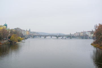 Panorama of an old Prague, bridges and embankment of Vitava river, Czechia