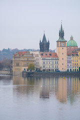 Fototapeta na wymiar Prague, Czechia - November, 24, 2016: Panorama of an old Prague, bridges and embankment of Vitava river, Czechia