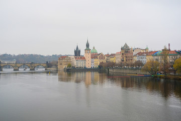 Prague,  Czechia - November, 24, 2016: Panorama of an old Prague, bridges and embankment of Vitava river, Czechia