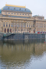 Obraz premium Prague, Czechia - November, 24, 2016: Panorama of an old Prague, bridges and embankment of Vitava river, Czechia
