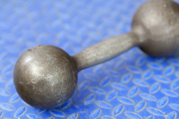 The image of dumbbells in a fitness hall