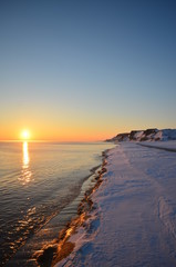 Sunset on a background of frozen sea