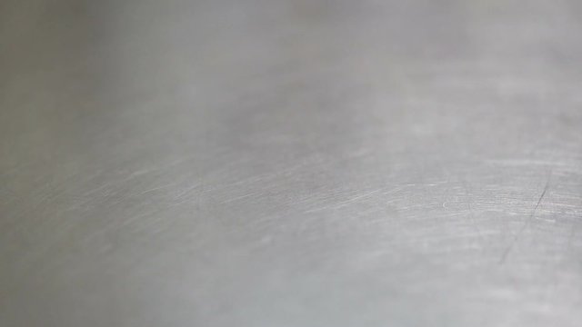Baker throwing flour on the table