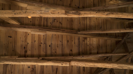 Interior view of a wooden roof structure in old building