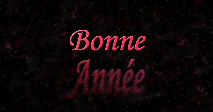 Happy New Year text in French "Bonne année" formed from dust and turns to dust horizontally on black animated background
