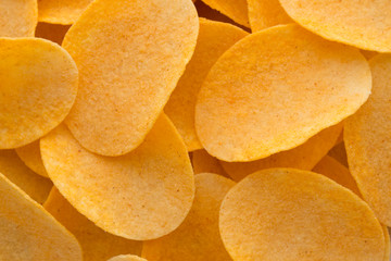 Close up potato chips on wood top view background.