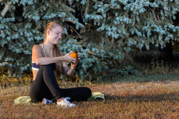 young girl resting sitting on the grass