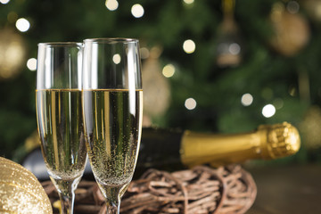 New Year Toast champagne , Christmas tree background
