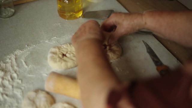 Preparation of belyashes. Traditional russian meat pies belyashi. belyashes on a table. Russian, Bashkir and Tatar cuisine.
