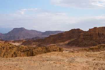 Fototapeta na wymiar The red and brown rocks and mountains in the timna park in Israel