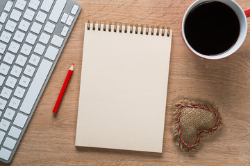 Blank notepad on wooden table