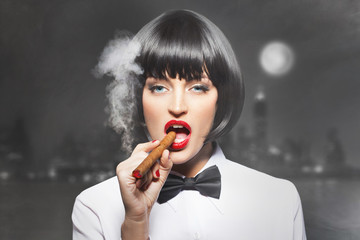 Sexy mafiosi woman boss smoke with cigar