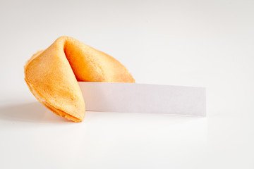 Chinese fortune cookie with prediction on white background