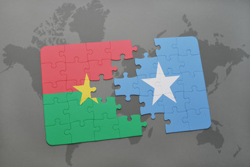 puzzle with the national flag of burkina faso and somalia on a world map