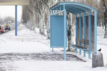 empty bus stop in snowy weather
