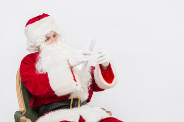 Santa Claus Reading Letter isolated over white baclground