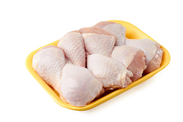 Raw chicken legs on retail tray