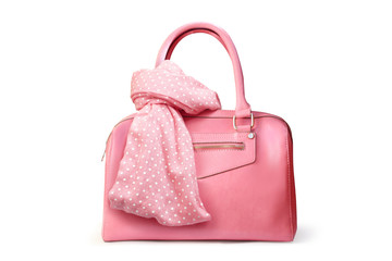 Stylish women's accessories. Beautiful set of women's handbag and scarf on a white background. Light pink, light coral