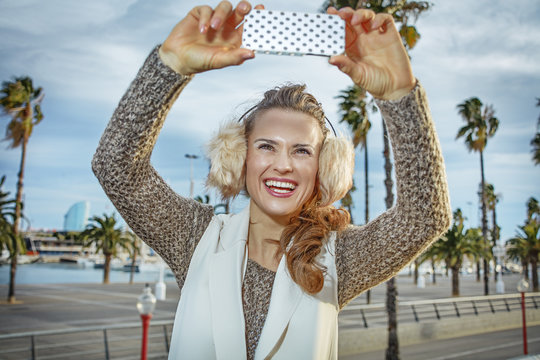 fashion-monger in Barcelona, Spain taking photo with smartphone