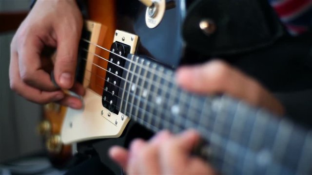 Guitarist Playing On Electrical Guitar. Slow Motion Effect