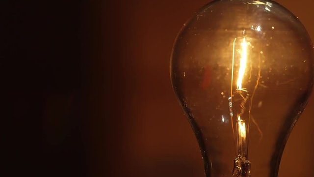 Low watt incandescent light bulb - Energy expense and finance concept