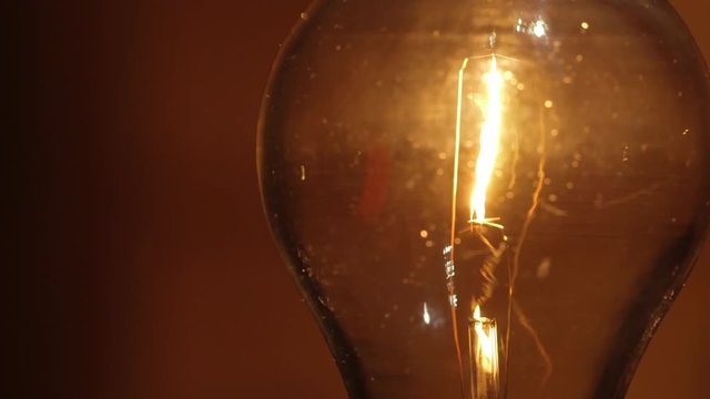 Low watt incandescent light bulb - Energy expense and finance concept