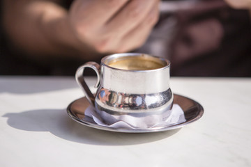 silver cup of coffee