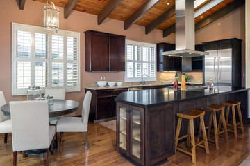 Amazing Wooden Kitchen with dark wood cabinets and island