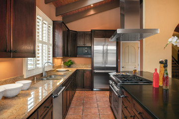 Amazing Wooden Kitchen with dark wood cabinets and island in med