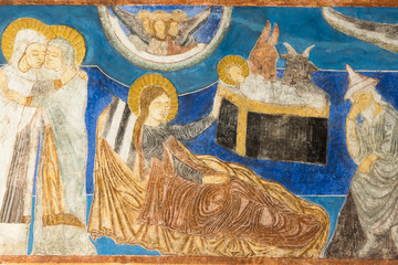 Romanesque fresco of the birth of Jesus Christ in the stable
