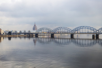 Picturesque view over the metal Railway Bridge over the Daugava river in Riga, Latvia