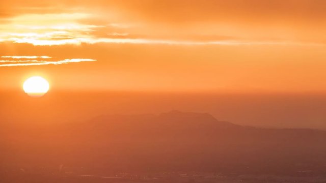 Los Angeles dawn clouds time lapse view towards Griffith Park in the San Fernando Valley.