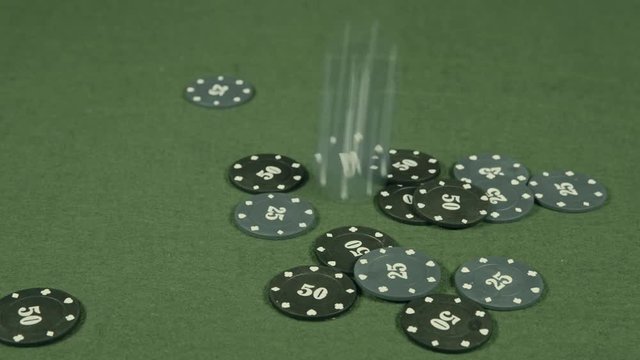 casino chips falling on a table.