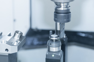 The flat end-mill cutting tool while measure tool diameter  by automatic tool measurement
