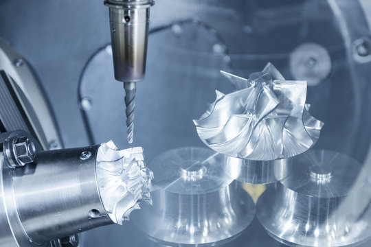 The abstract scene of  five-axis Computer Numerical Control (CNC) while cutting f aerospace sample part