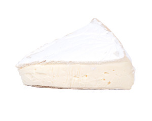 Supremely creamy soft ripened brie cheese isolated on white background