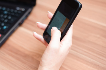 Closeup of hands of beautiful business woman working with comput