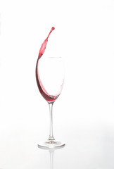 red wine poured from a glass