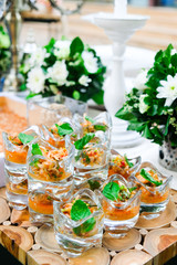 Spicy Shrimp in shot glass on wood table