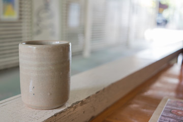 A cup of ceramic tea.