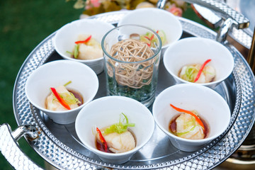 Sea bass steamed with soy sauce in white cup