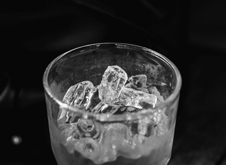 Ice in the glass low key dark theme black and wite