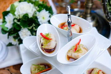 Sea bass steamed with soy sauce in white cup