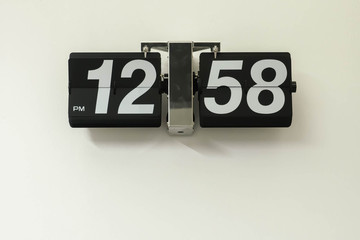 flib clock on white wall