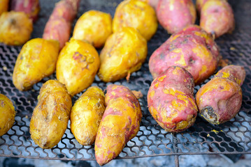  grilled sweet potato on charcoal grill