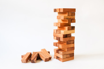 Wood block Stack tower game for children playing on wooden table with copyspace, Learning and Education background concept