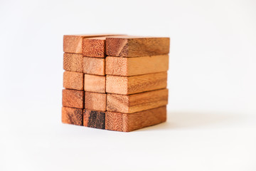 Wood block Stack tower game for children playing on wooden table with copyspace, Learning and Education background concept