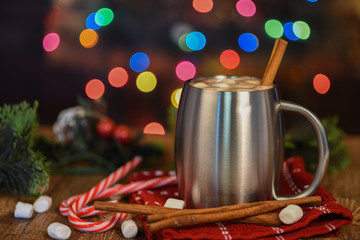 Hot chocolate in silver stainless steel cup with Christmas decor