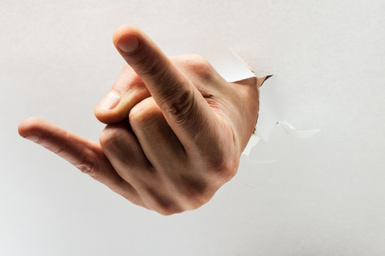 Devil Hand Sign Through Thorned Paper