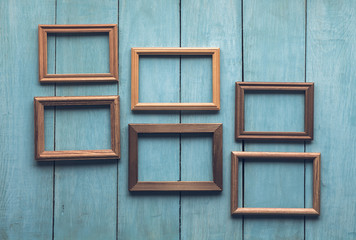 old frames on wooden wall